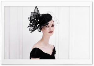 Woman Wearing a Fancy Black Hat
