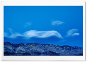 Wavy Clouds above The Mountains