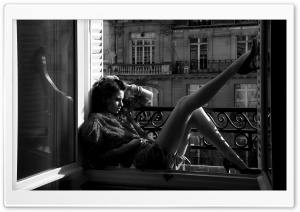 Woman Sitting Near The Window