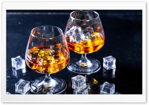 Glass of Cognac with Ice Cubes